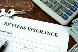 signing papers for Renters Insurance