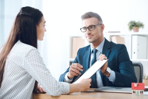 Hawaii insurance agent showing contract for Self Funded Insurance