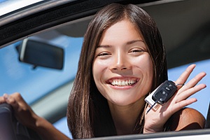 Brunette girl in car with keys