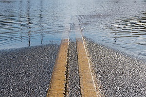 Flooded road with yellow lines