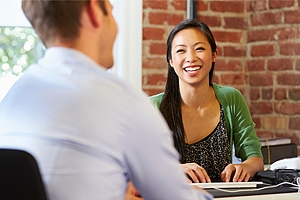 Smiling woman at meeting