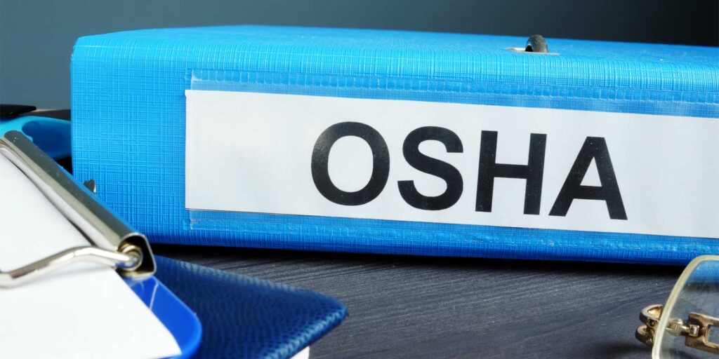 a binder containing information about OSHA