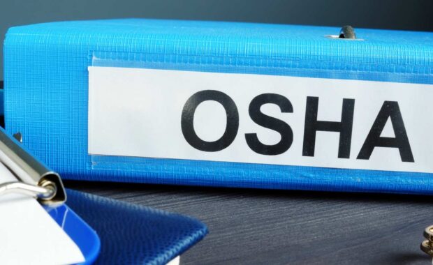 a binder containing information about OSHA