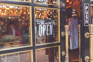 Image of a storefront with an open sign