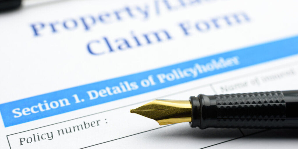 liability claim form on a clipboard