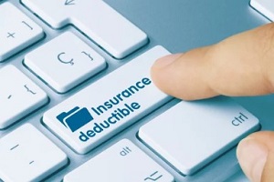 man pressing insurance deductible key on the keyboard