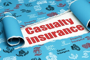red text casualty insurance under the piece of torn paper