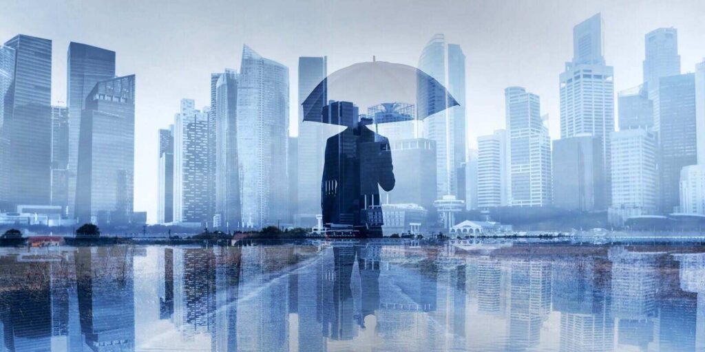 businessman with umbrella double exposure