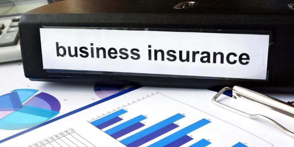 folder with the label business insurance and charts