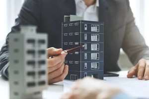 man showing commercial building model