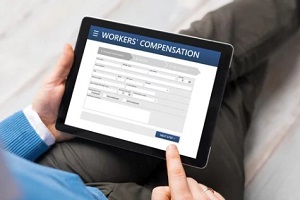 person filling worker compensation form