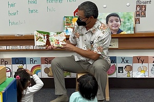 russ reading books to children in a classroom