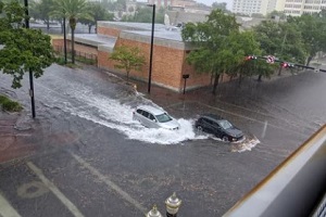 cars and buildings in flood