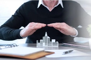 man covering commercial building