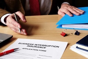 man showing business interruption insurance form