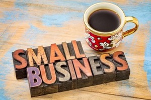 small business on wooden blocks with coffee cup