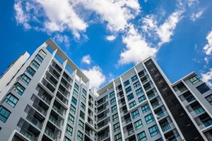 big Hawaiian condominium buildings with blue sky