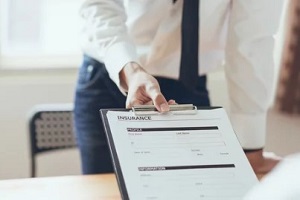 man showing insurance papers