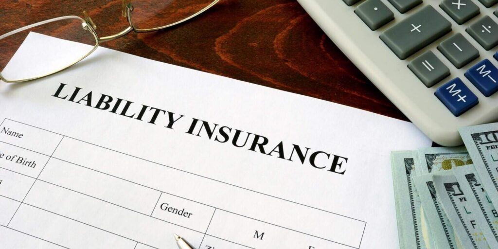 general liability insurance form and dollars on the table