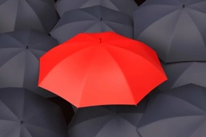 red umbrella in black umbrellas