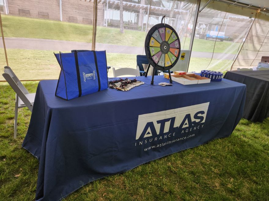 this is a picture of Atlas Insurance's table at the Lanakila Pacific INSPO! Event for 2024.