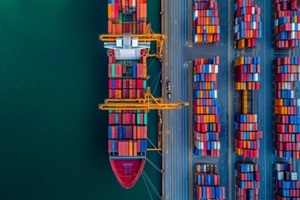 cargo ship loaded with colorful containers at a commercial dock