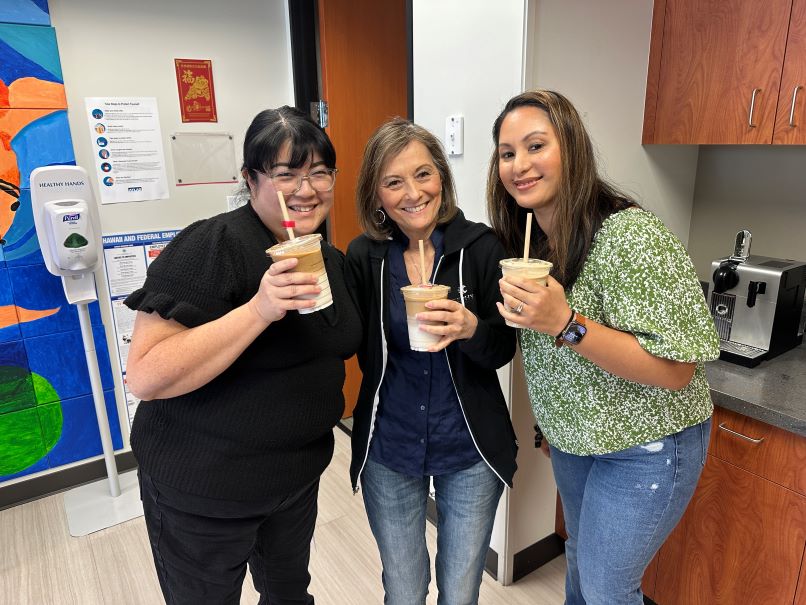 This is a picture of Atlas employees enjoying Cotti Coffee for our monthly office cafe event