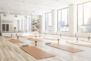 concrete yoga gym interior with equipment