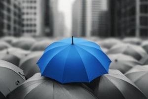 mock-up featuring a blue umbrella prominently positioned on top of several gray umbrellas