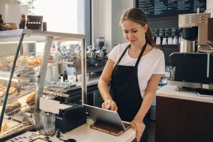 portrait of young caucasian female woman cashier