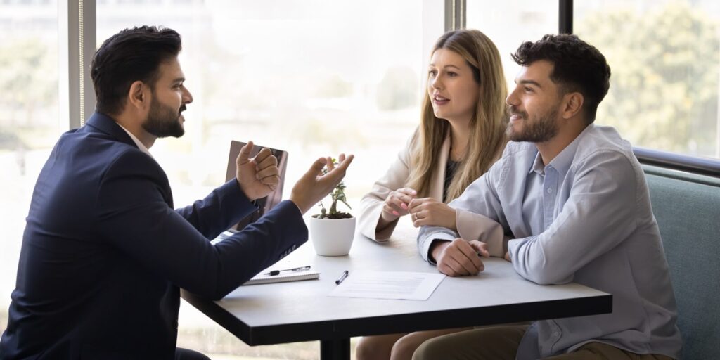 Hawaii small business owners meeting with insurance agent