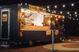 food truck has burgers and drinks for sale