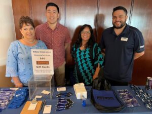 this is a picture of Atlas employees at the community council of Maui Annual Trade Show