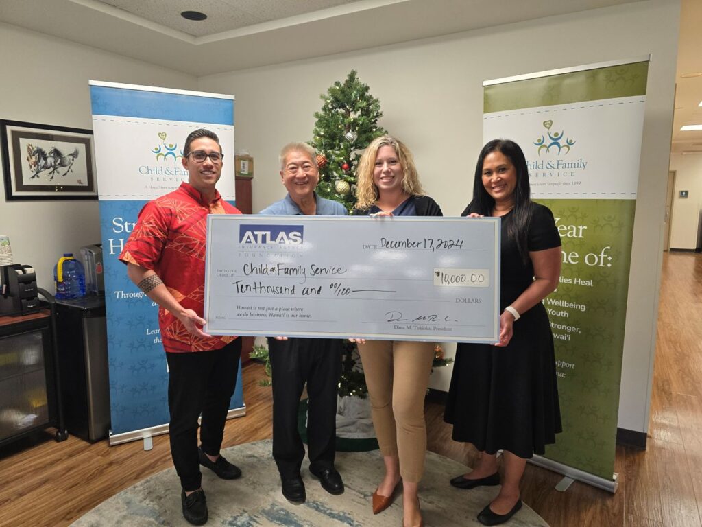 this is a photo of Atlas Insurance Agency's check presentation to Child & Family Service of Hawaii