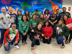 picture of Atlas employees in their ugly sweater shirts for national ugly sweater day