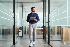 Hawaii man walking in office lobby