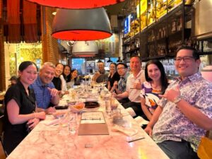 this is a photo of Atlas employees with Redhammer at 1938 Indochine for a Pau Hana