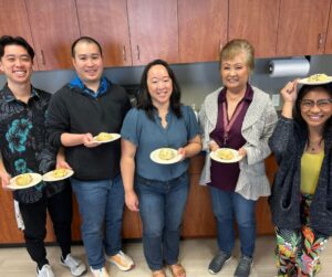 This is a photo of Atlas employees enjoying scones from Sconees Bakery