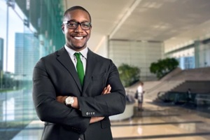 african american bank manager owner ceo business man standing confidently with pride in financial building