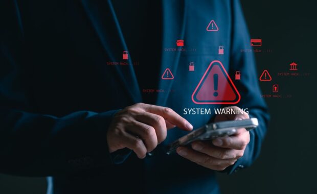 Hawaii non-profit insurance agent using smartphone facing system warning and cyber attack alert