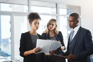 teamwork and documents with Hawaii business people in office for legislation