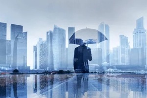 insurance concept, risk in business, businessman with umbrella double exposure