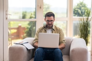 Professional Freelancer Working on Laptop at Home