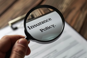 Insurance Policy Document Under Magnifying Glass