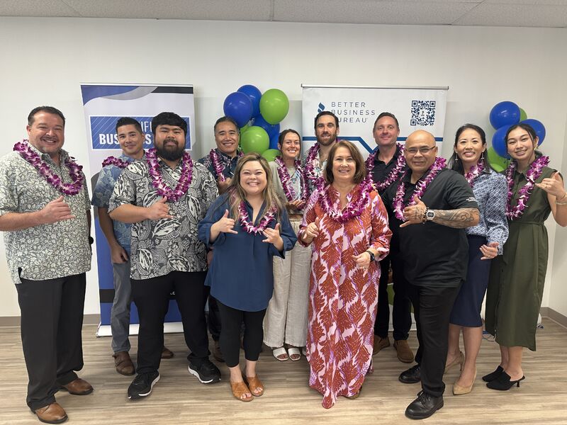 Smiling Atlas Insurance Team members at a BBB awards ceremony