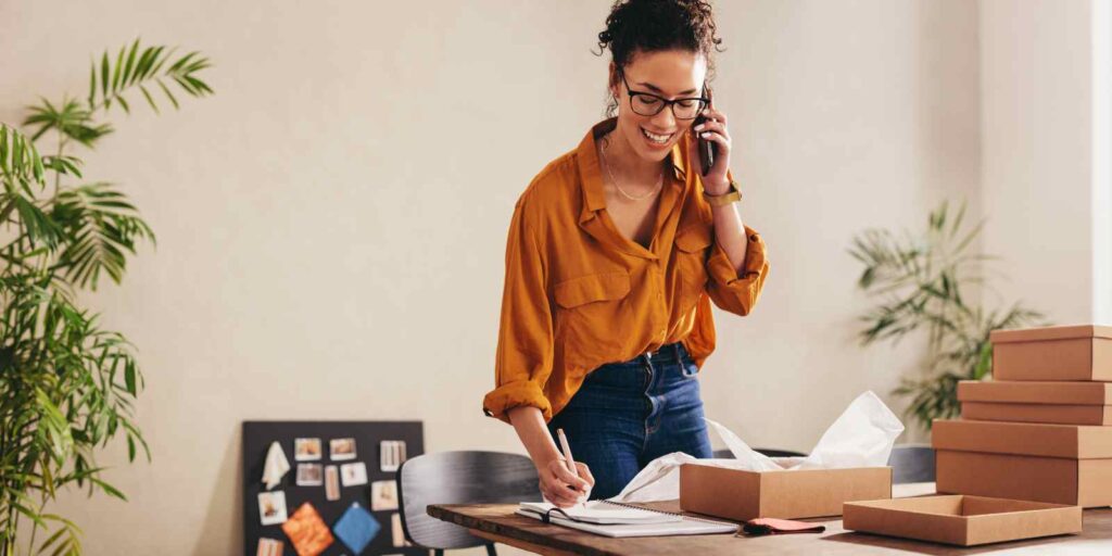 Home Based Business Woman Confirming Order on Phone