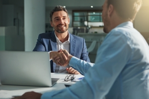 Businessman Shaking Hand After Hiring A New Employee