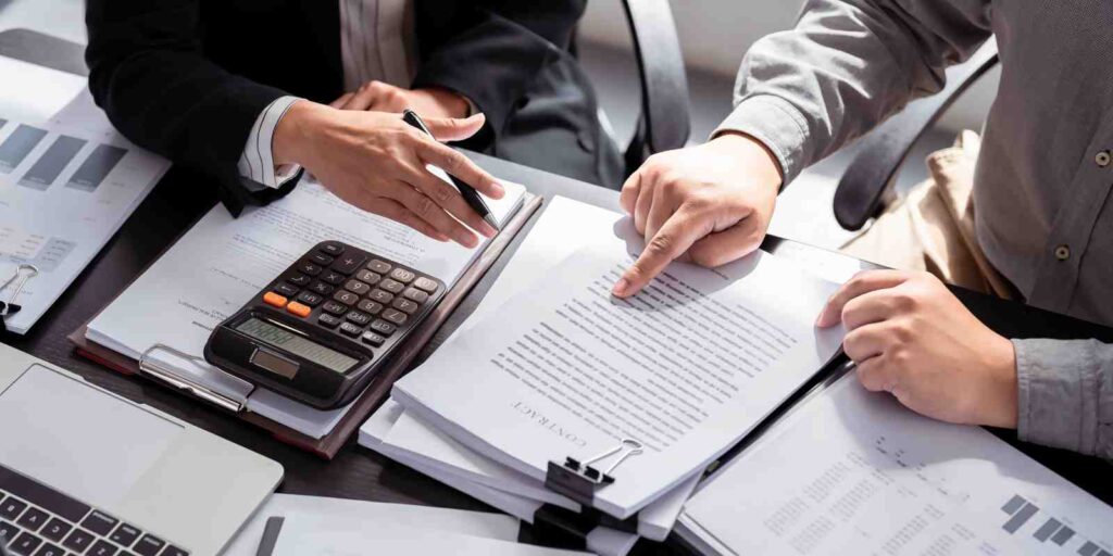 Businessmen Discussing Insurance Plan After Hiring New Employees