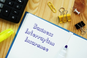 Business Interruption Insurance with Marker on Piece of Paper
