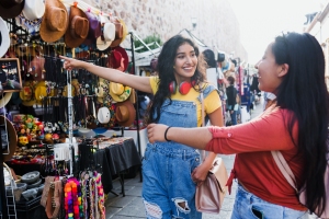 Young Tourist Girls Looking Stuff at Local Shop